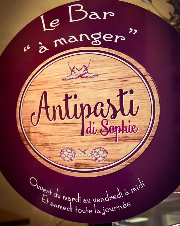 La plaque ronde du Bar à manger, ouvert du mardi au vendredi à midi et samedi toute la journée